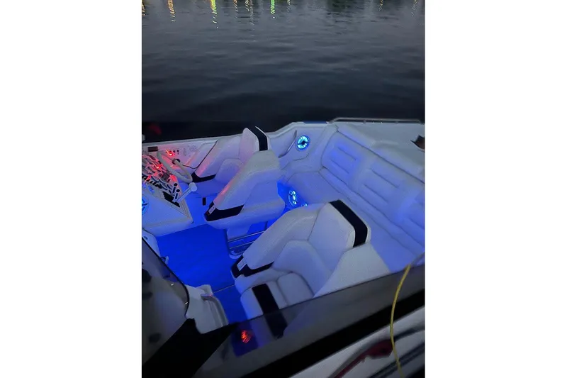 Slide: The Image of 2000 Fountain 32 Fever boat interior with blue LED lighting at night. - 9