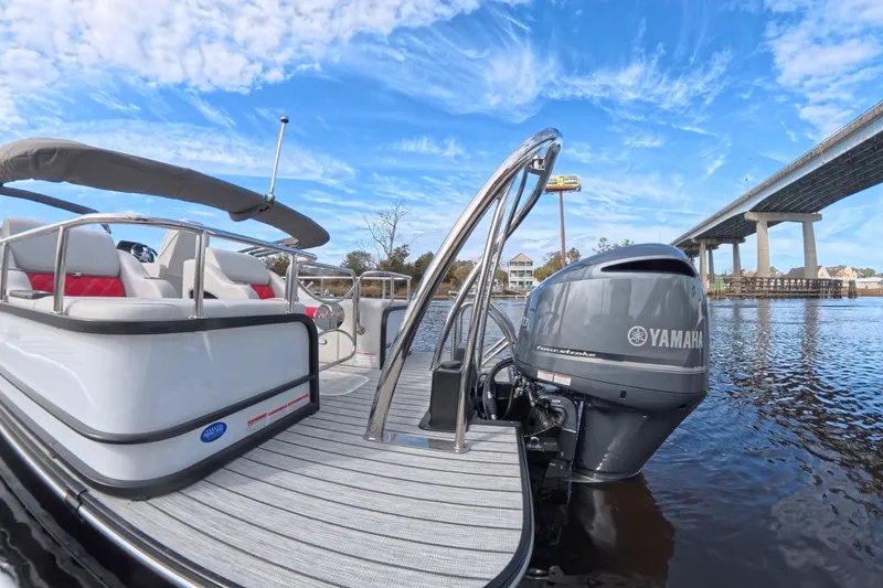 Slide: The Image of 2025 SunCatcher ELITE SERIES 324 SS pontoon boat with Yamaha engine on a sunny day. - 12