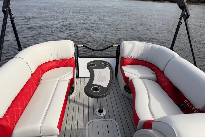 Slide: The Image of Luxurious 2025 SunCatcher ELITE SERIES 324 SS boat interior with red and white seating. - 18