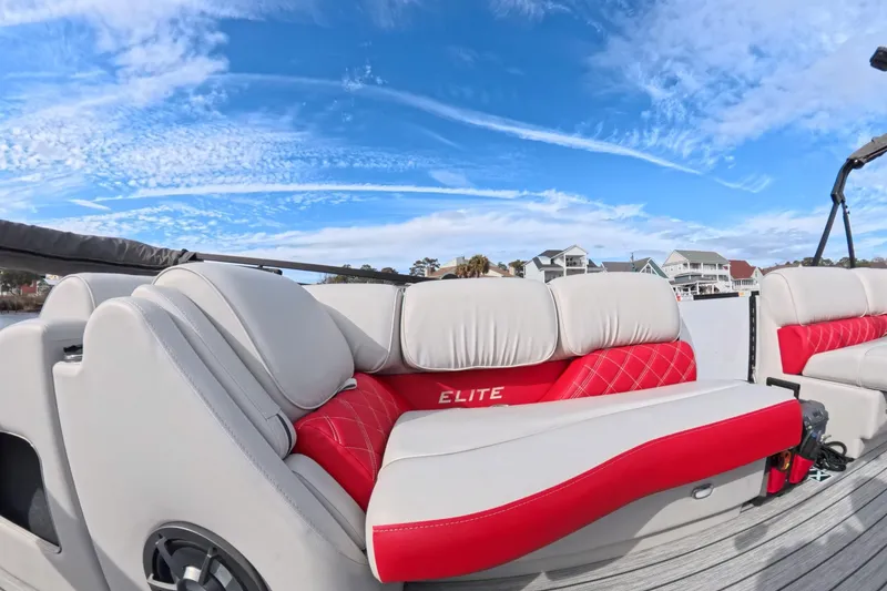 Slide: The Image of Luxury seating on 2025 SunCatcher ELITE SERIES 324 SS boat under clear blue sky. - 20