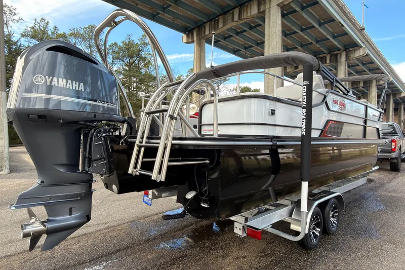 Slide: The Image of 2025 SunCatcher ELITE SERIES 324 SS pontoon boat with Yamaha engine under a bridge. - 7