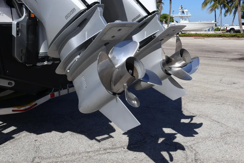 Slide: The Image of 2024 XO Boats EXPLR 10 S Plus dual outboard motors with stainless steel propellers. - 16