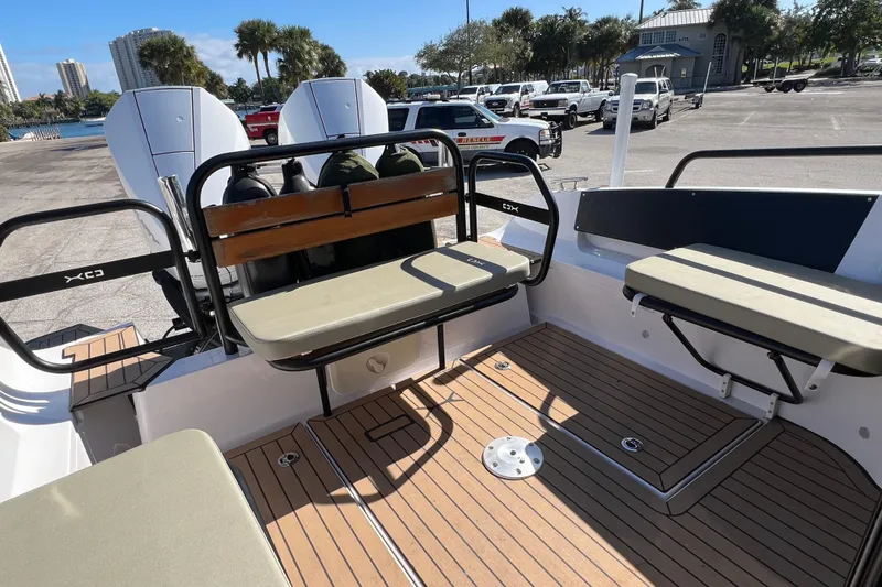 Slide: The Image of 2024 XO Boats EXPLR 10 S Plus interior with seating and deck view. - 20