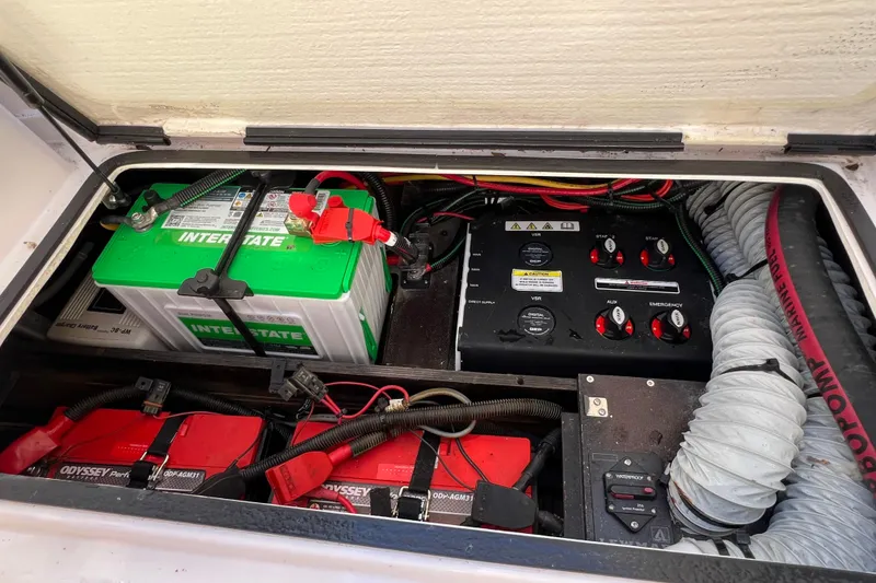 Slide: The Image of 2024 XO Boats EXPLR 10 S Plus battery compartment with Interstate and Odyssey batteries. - 30