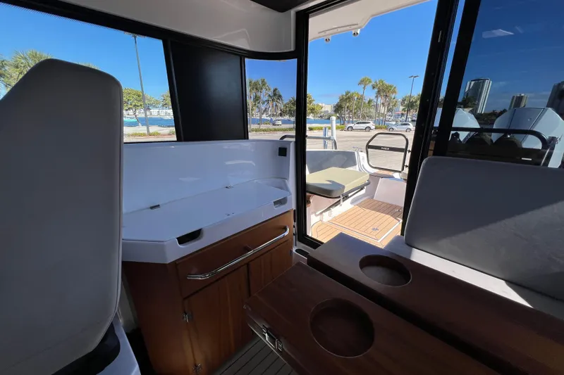 Slide: The Image of Interior view of 2024 XO Boats EXPLR 10 S Plus, featuring seating and cabinetry. - 41