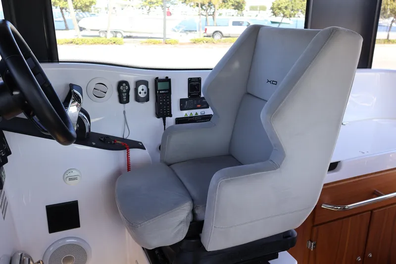 Slide: The Image of 2024 XO Boats EXPLR 10 S Plus cockpit with modern controls and comfortable seating. - 56