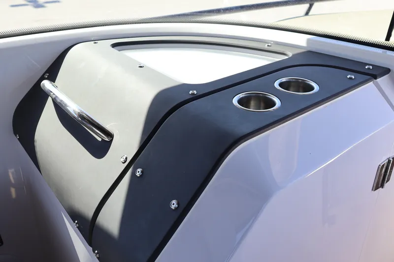 Slide: The Image of 2024 XO Boats EXPLR 10 S Plus dashboard with cup holders and handle. - 60