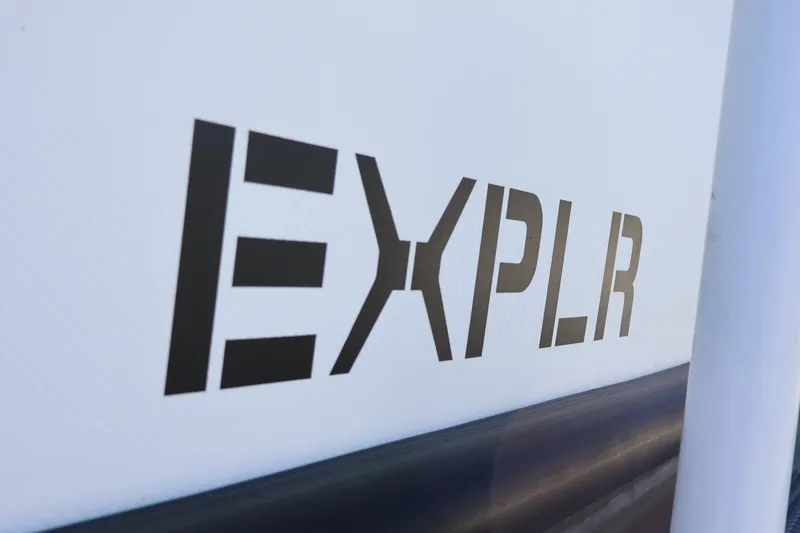 Slide: The Image of 2024 XO Boats EXPLR 10 S Plus logo on boat exterior. - 68