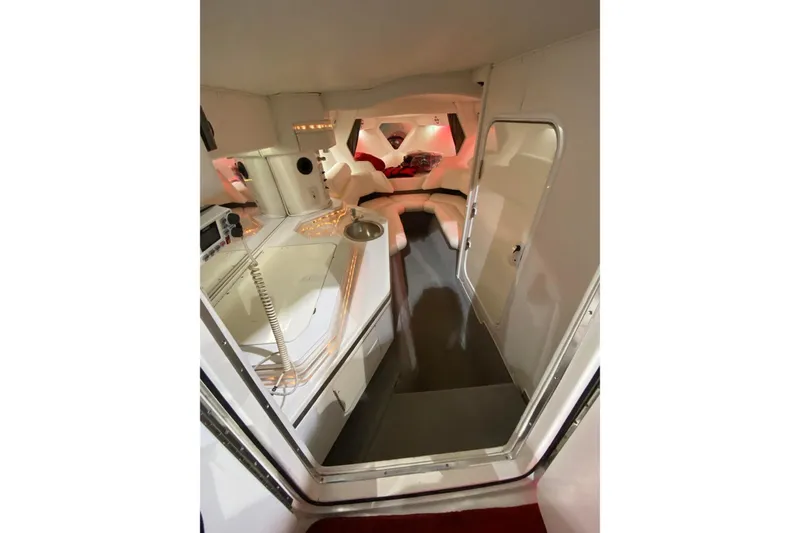 Slide: The Image of 2004 Fountain 38 Lightning boat interior with kitchenette and seating area. - 14