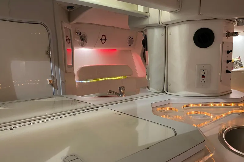 Slide: The Image of Interior of a 2004 Fountain 38 Lightning boat with modern lighting and sleek design. - 19