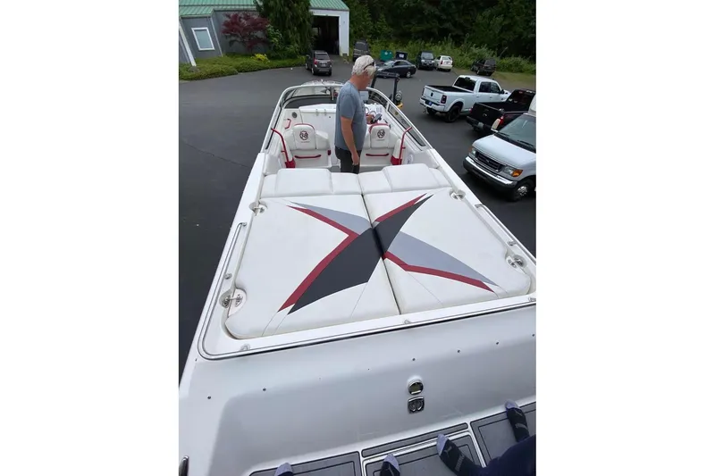 Slide: The Image of 2004 Fountain 38 Lightning boat with custom seating design in a parking area. - 9