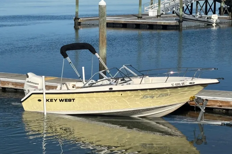 The Image of Key West 2020 Dual Console boat docked on calm water, 2004 model. - 0