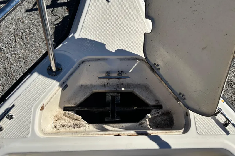 Slide: The Image of Open anchor compartment on a 2004 Key West 2020 Dual Console boat. - 16