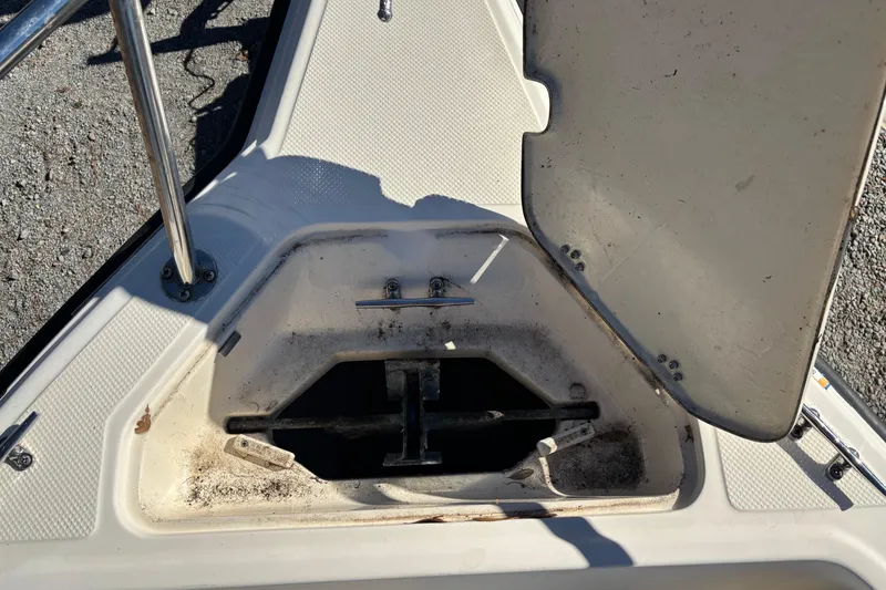 Slide: The Image of Open anchor compartment on a 2004 Key West 2020 Dual Console boat. - 17