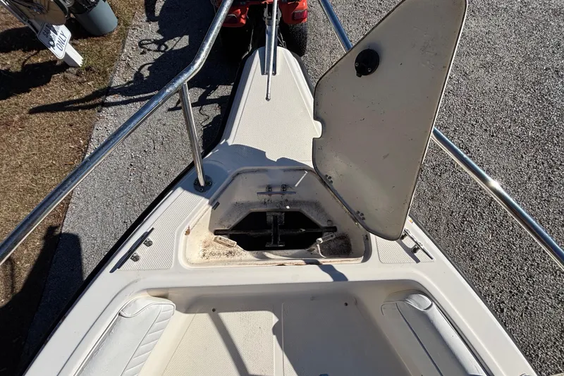 Slide: The Image of Open storage compartment on 2004 Key West 2020 Dual Console boat deck. - 18