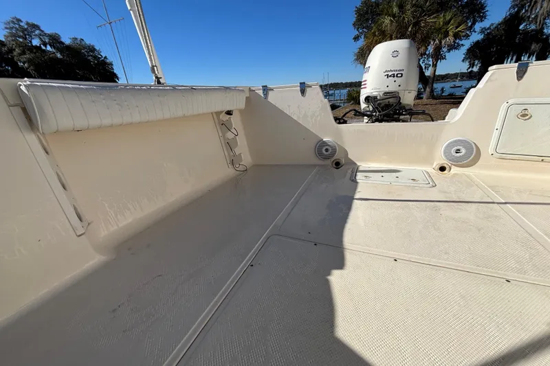 Slide: The Image of 2004 Key West Dual Console boat interior with Johnson 140 outboard motor. - 22