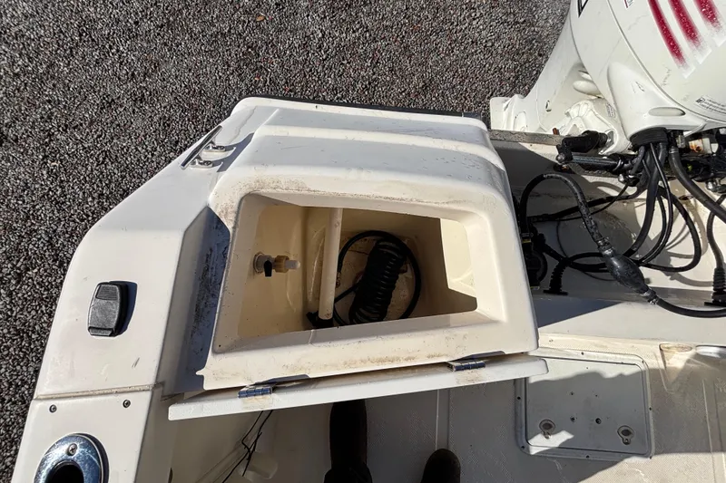 Slide: The Image of Open storage compartment on a 2004 Key West 2020 Dual Console boat. - 29