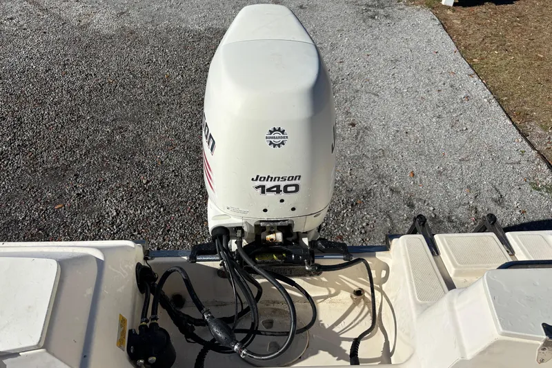 Slide: The Image of Outboard motor on a 2004 Key West 2020 Dual Console boat, Johnson 140 HP. - 4