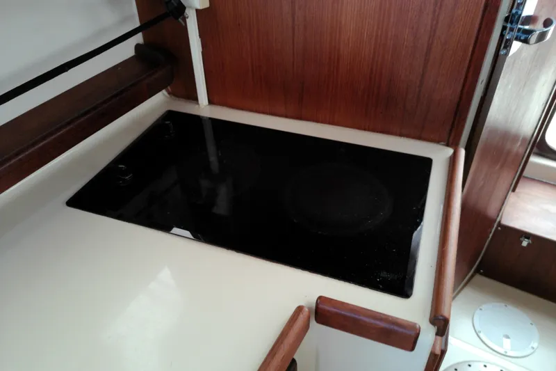 Slide: The Image of Stovetop in 2010 Ranger Tugs R-25 boat kitchen area. - 10