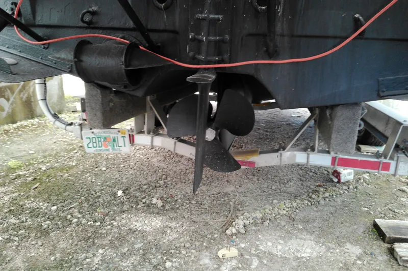 Slide: The Image of 2010 Ranger Tugs R-25 boat propeller and trailer, Florida license plate visible. - 19