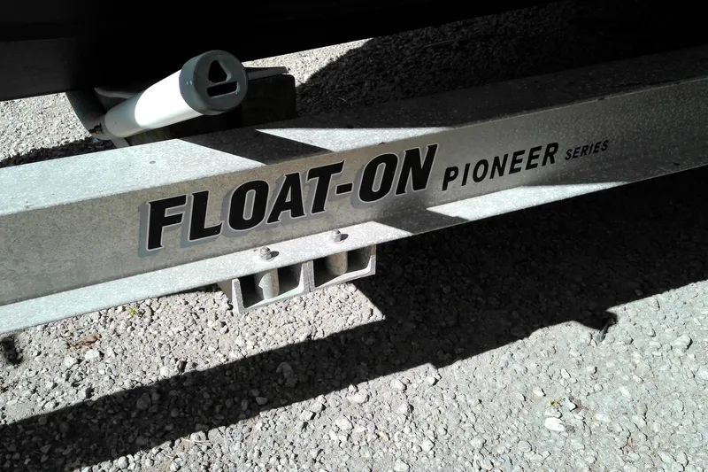 Slide: The Image of Float-On Pioneer Series trailer for 2010 Ranger Tugs R-25 on gravel surface. - 21
