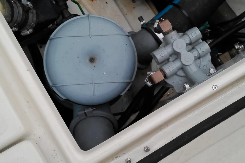 Slide: The Image of Engine compartment of a 2010 Ranger Tugs R-25 boat, showing mechanical components. - 27