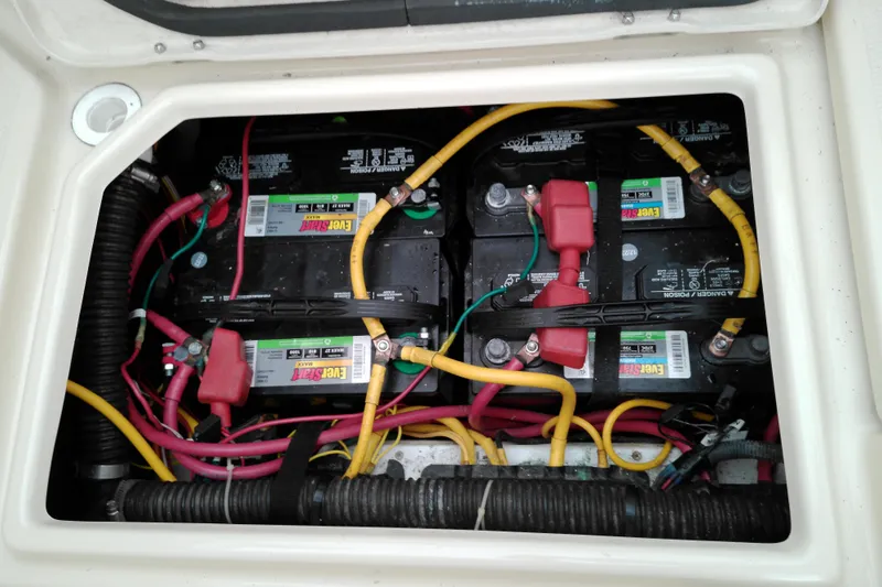 Slide: The Image of Battery compartment of a 2010 Ranger Tugs R-25 with connected cables. - 3