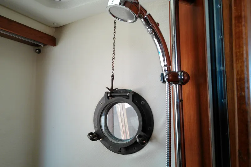 Slide: The Image of Interior of 2010 Ranger Tugs R-25 boat with porthole and showerhead. - 31