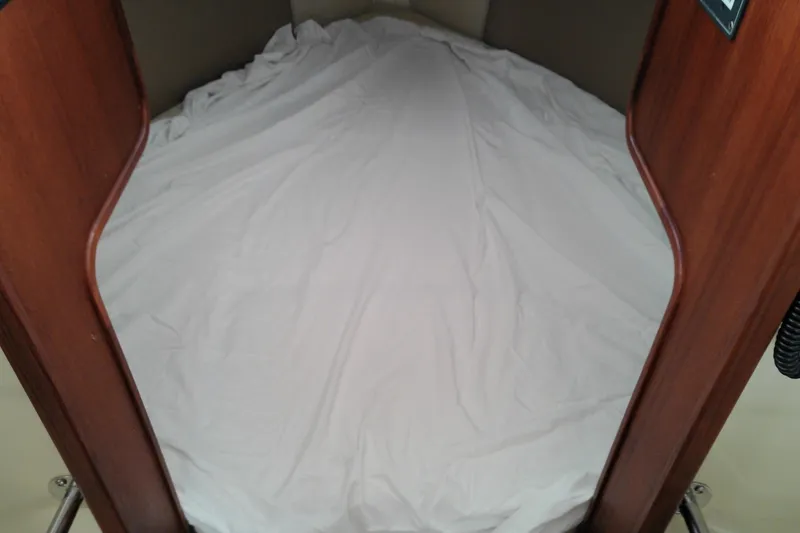 Slide: The Image of Interior cabin view of 2010 Ranger Tugs R-25 with a neatly made bed. - 34