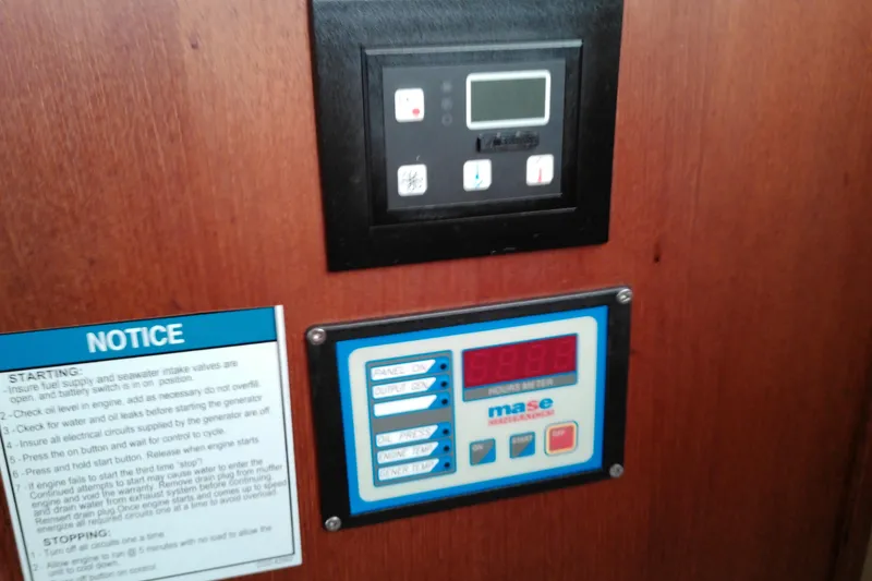 Slide: The Image of Control panel and notice on 2010 Ranger Tugs R-25 boat interior. - 35