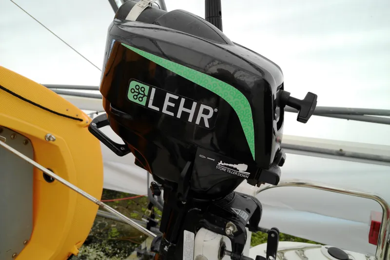 Slide: The Image of Lehr outboard motor on a 2010 Ranger Tugs R-25 boat, featuring a yellow seat. - 5