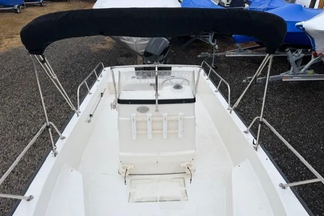 Slide: The Image of 2017 Boston Whaler 190 Montauk boat with black canopy, viewed from above. - 10