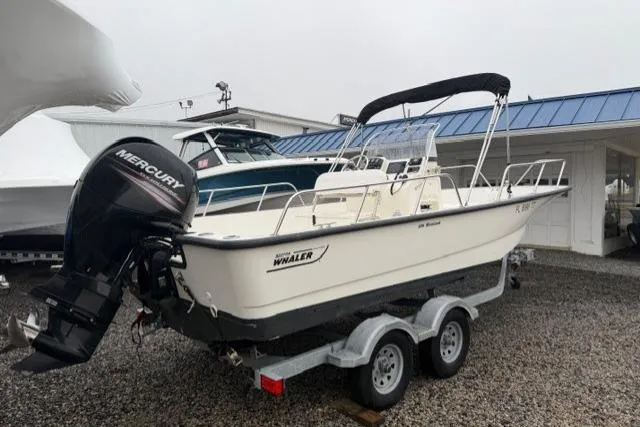 Slide: The Image of 2017 Boston Whaler 190 Montauk boat on trailer with Mercury outboard motor. - 4