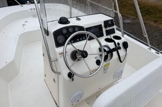 Slide: The Image of 2017 Boston Whaler 190 Montauk boat console with steering wheel and controls. - 5