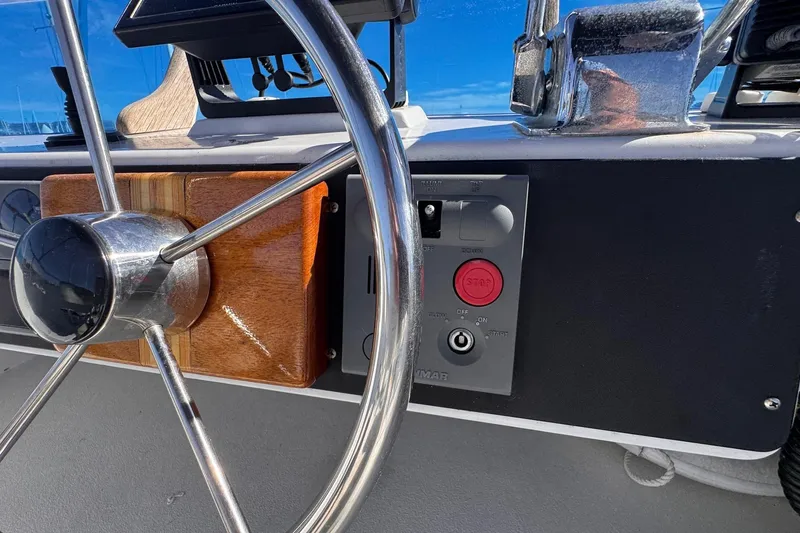 Slide: The Image of Close-up of 1972 Gandy Flybridge boat steering wheel and control panel. - 12