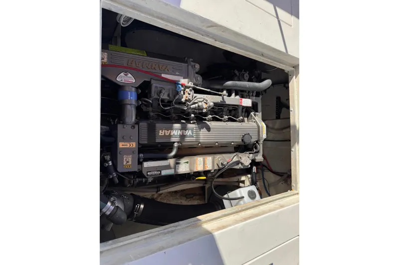 Slide: The Image of 1972 Gandy Flybridge engine compartment with visible Yanmar engine components. - 9