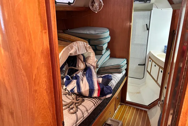 Slide: The Image of Interior of 1999 Catalina 42 MkII sailboat with cushions and bathroom view. - 14