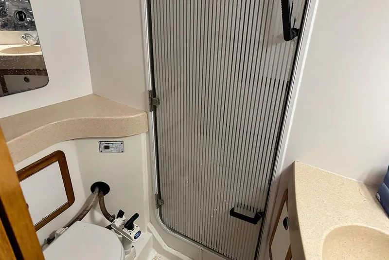 Slide: The Image of Bathroom interior of a 1999 Catalina 42 MkII sailboat with shower and toilet. - 15