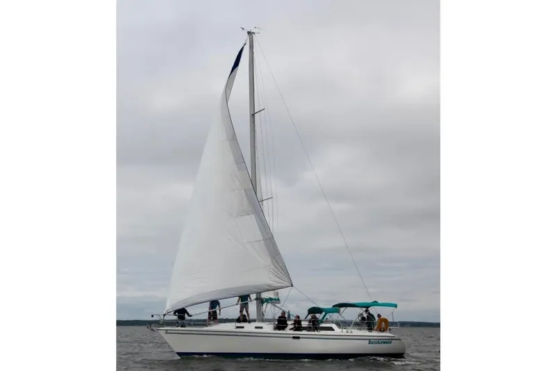 Slide: The Image of Sailing yacht Catalina 42 MkII 1999 on open water under cloudy skies. - 2