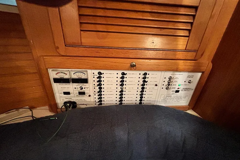 Slide: The Image of Control panel of a 1999 Catalina 42 MkII sailboat with gauges and switches. - 21