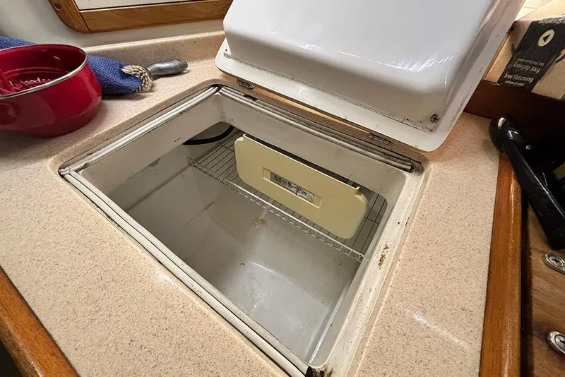 Slide: The Image of Open refrigerator compartment on a 1999 Catalina 42 MkII yacht kitchen counter. - 22
