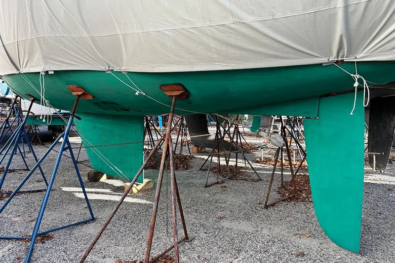 Slide: The Image of 1999 Catalina 42 MkII sailboat on stands, covered and ready for maintenance. - 26