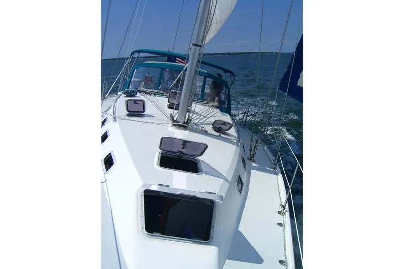Slide: The Image of Sailing on a 1999 Catalina 42 MkII yacht in open waters. - 5