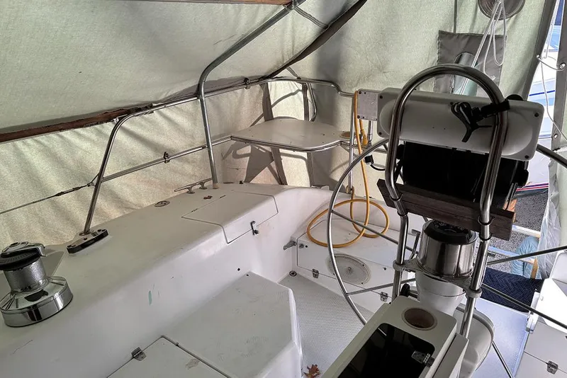 Slide: The Image of Interior view of a 1999 Catalina 42 MkII sailboat cockpit under cover. - 8