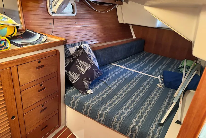 Slide: The Image of Cozy cabin interior of 1999 Catalina 42 MkII sailboat with nautical-themed decor. - 9