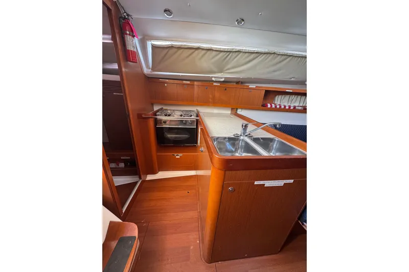 Slide: The Image of Interior of 2014 Beneteau Oceanis 34 yacht kitchen with stove and sink. - 16