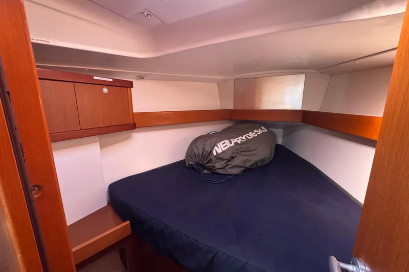 Slide: The Image of Cozy cabin interior of 2014 Beneteau Oceanis 34 sailboat with wooden accents. - 27