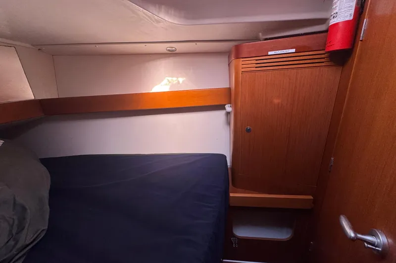 Slide: The Image of Cozy cabin interior of 2014 Beneteau Oceanis 34 sailboat with wooden cabinetry. - 28