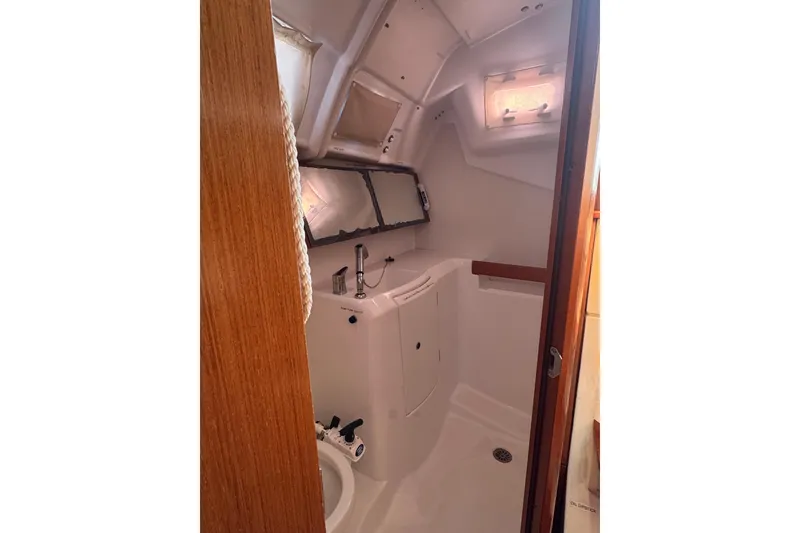 Slide: The Image of Interior of 2014 Beneteau Oceanis 34 sailboat bathroom with compact design. - 29