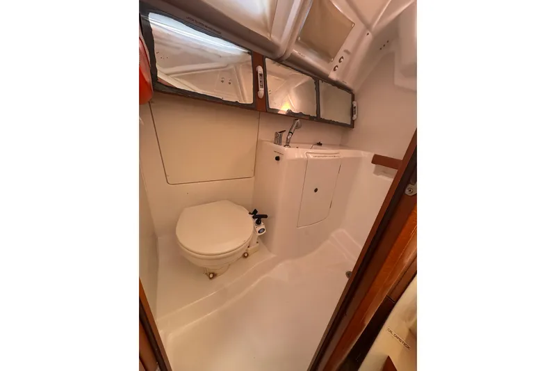 Slide: The Image of Interior of 2014 Beneteau Oceanis 34 yacht bathroom with toilet and sink. - 31